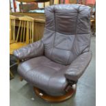A Norweigan Ekorness beech and leather Stressless revolving lounge chair