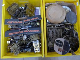 Two boxes of assorted clock movements, pendulums, etc.