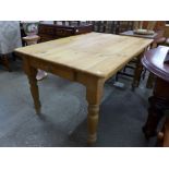A pine single drawer farmhouse kitchen table