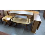A simulated rosewood drop leaf table and a coffee table and a teak nest of tables and coffee table