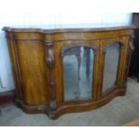 A Victorian walnut serpentine credenza