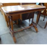 A Victorian Aesthetic Movement walnut stretcher table