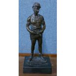 A bronze figure of a miner