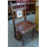 A Victorian Aesthetic Movement mahogany metamorphic library chair/step, inset with Mintons style