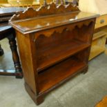 An Edward VII oak student's bureau and an open bookcase