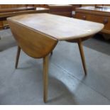 An Ercol elm and beech Windsor drop-leaf table