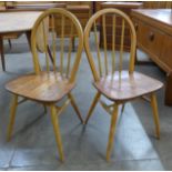 A pair of Ercol elm and beech Windsor chairs