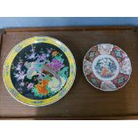 A Japanese famille noir porcelain charger and an Imari pattern dish