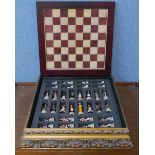 A Napoleonic figural chess resin set, in a table top box with board
