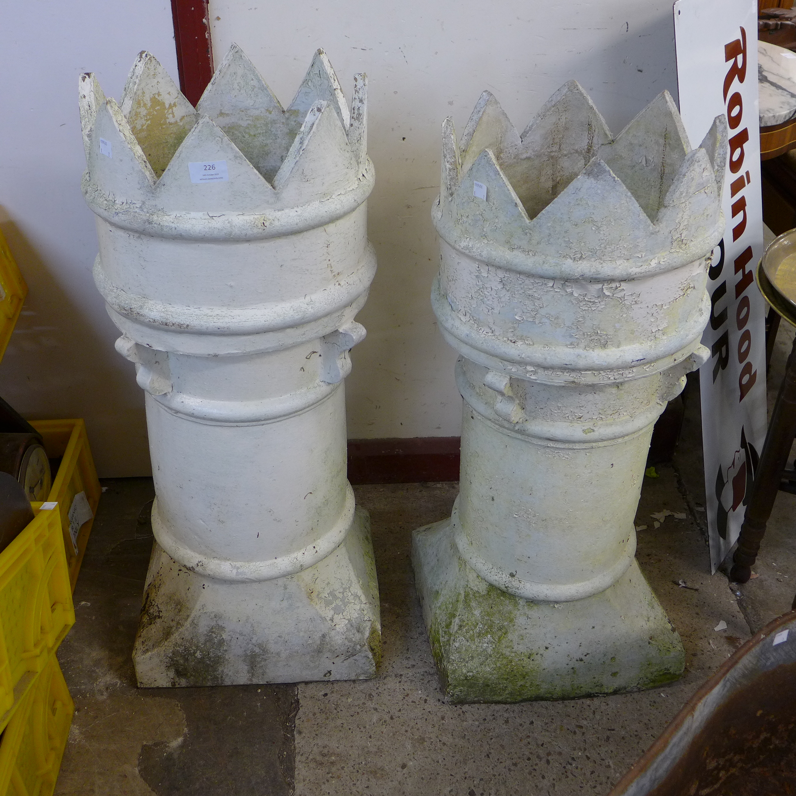 Two painted terracotta crown top chimney-pots