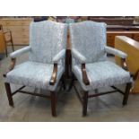 A pair of George III style mahogany and fabric upholstered Gainsborough chairs