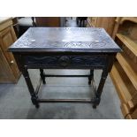 A 17th Century style carved oak single drawer side table
