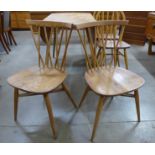 A pair of Ercol elm and beech 376 model candlestick chairs