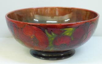 An early 20th Century Moorcroft bowl, anemone pattern with flambe glaze, signed on the base, 23.5cm,