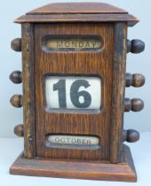 A wood and linen perpetual desk calendar