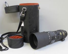 A Nikon ED AF Nikkor 300mm 1:4 telephoto lens with case