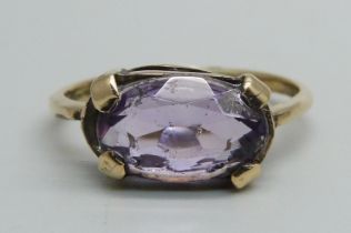 A 14ct gold and oval amethyst set ring, 3.6g, R