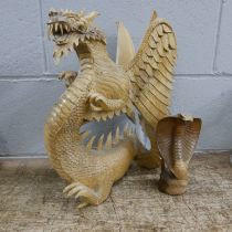 A carved model of a dragon and a cobra **PLEASE NOTE THIS LOT IS NOT ELIGIBLE FOR POSTING AND