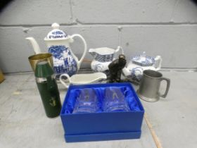 Blue and white china, two glasses with golfer motifs, a gold drinks flask with cups, a metal figure,