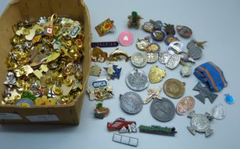 A collection of badges and pin badges, including a silver ARP badge, RAF brooch and Civil Defence