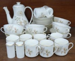 A Royal Doulton Yorkshire Rose eight setting coffee service, lacking one saucer, one additional