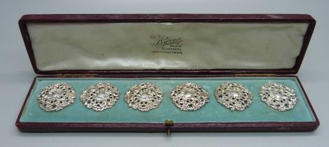 A cased set of six Victorian ornate silver buttons, Birmingham 1900, by Levi and Salaman, 28mm