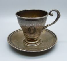 An .800 silver cup and saucer, 79g