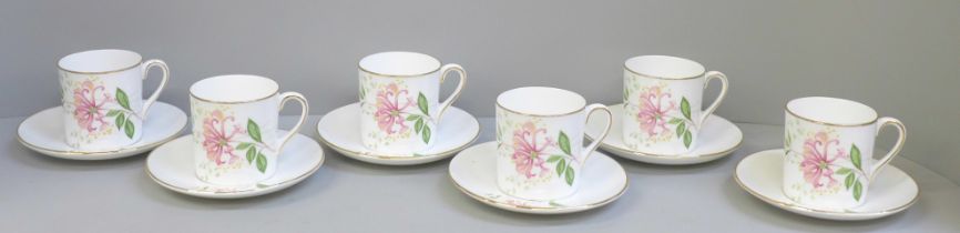 Six Shelley coffee cans and saucers decorated with flowers