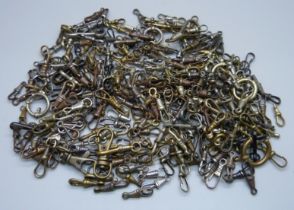 A collection of Albert pocket watch chain dog clip clasps and bolt rings