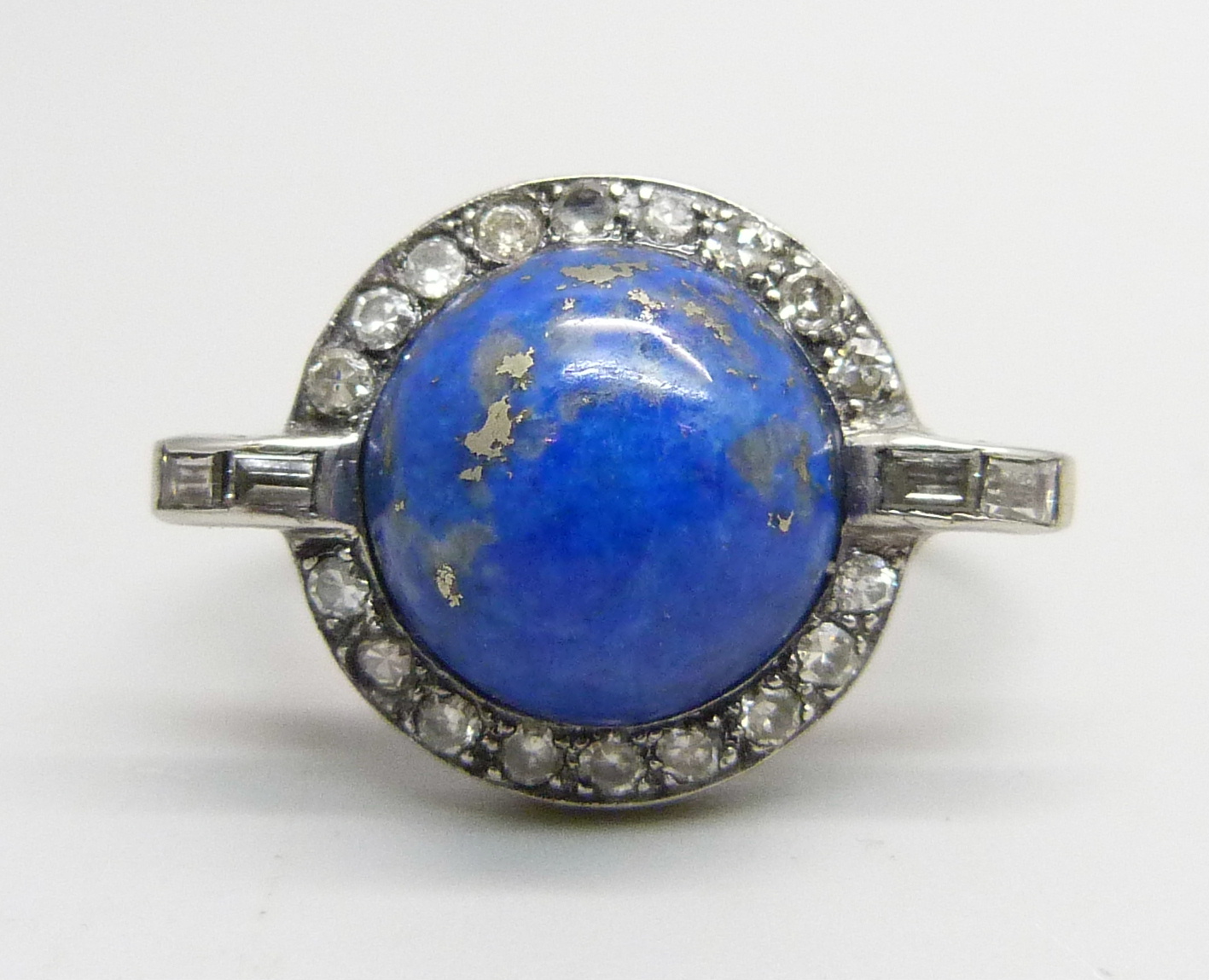 An 18ct gold, Art Deco lapis lazuli and paste ring, 6.8g, T