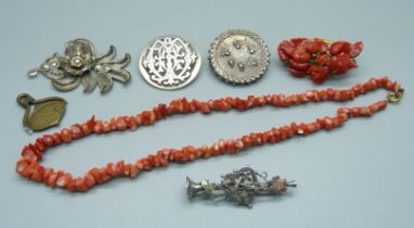 A Victorian silver brooch, a coral brooch and necklace, two other c1900 brooches, etc.