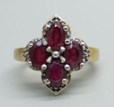 A silver gilt ring set with four rubies, L