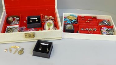 A white jewellery box containing costume jewellery