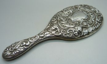 A William Comyns embossed silver hand mirror, London 1900