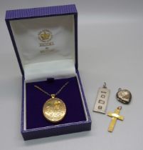 A 9ct gold cross pendant, 1g, a/f, a silver ingot pendant, 14.5g, a silver back and front locket and