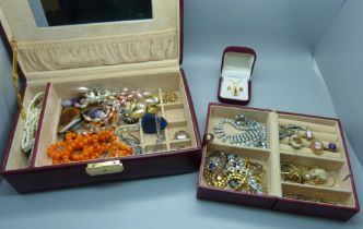 A case of costume jewellery including tigers eye and amethyst quartz pendants