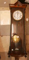 A 19th Century walnut Vienna wall clock (lacking weights)