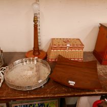 A teak fruit bowl, a teak table lamp, a wicker sewing basket and a plated salver