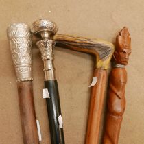 Four assorted walking canes
