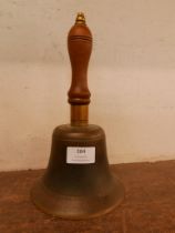 A vintage bronze school hand bell