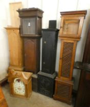 Three oak longcase clock cases and a pine longcase clock case