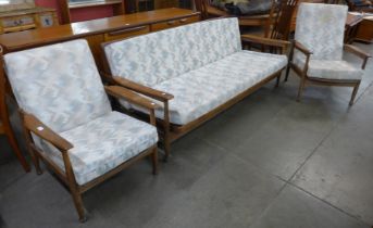 A Guy Rogers teak and fabric upholstered Manhattan range three piece lounge suite, comprising