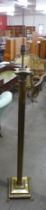 A brass Corinthian column standard lamp