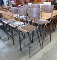 A set of six tubular steel and bent plywood stools