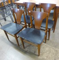 A set of four teak dining chairs