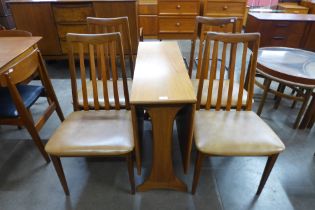 A G-Plan Fresco teak drop leaf table and four chairs