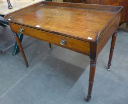 A George IV mahogany two drawer writing table