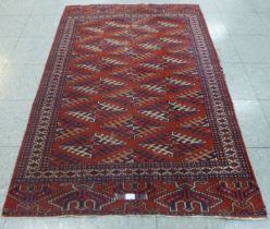 An eastern Tekke Turkoman tight hand knotted antique rug, 166 x 109cms