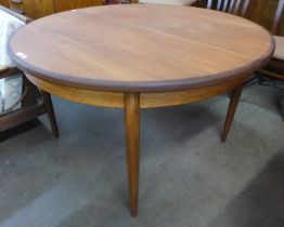 A G-Plan Fresco teak circular extending dining table