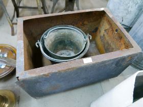 A galvanised water tank and two buckets